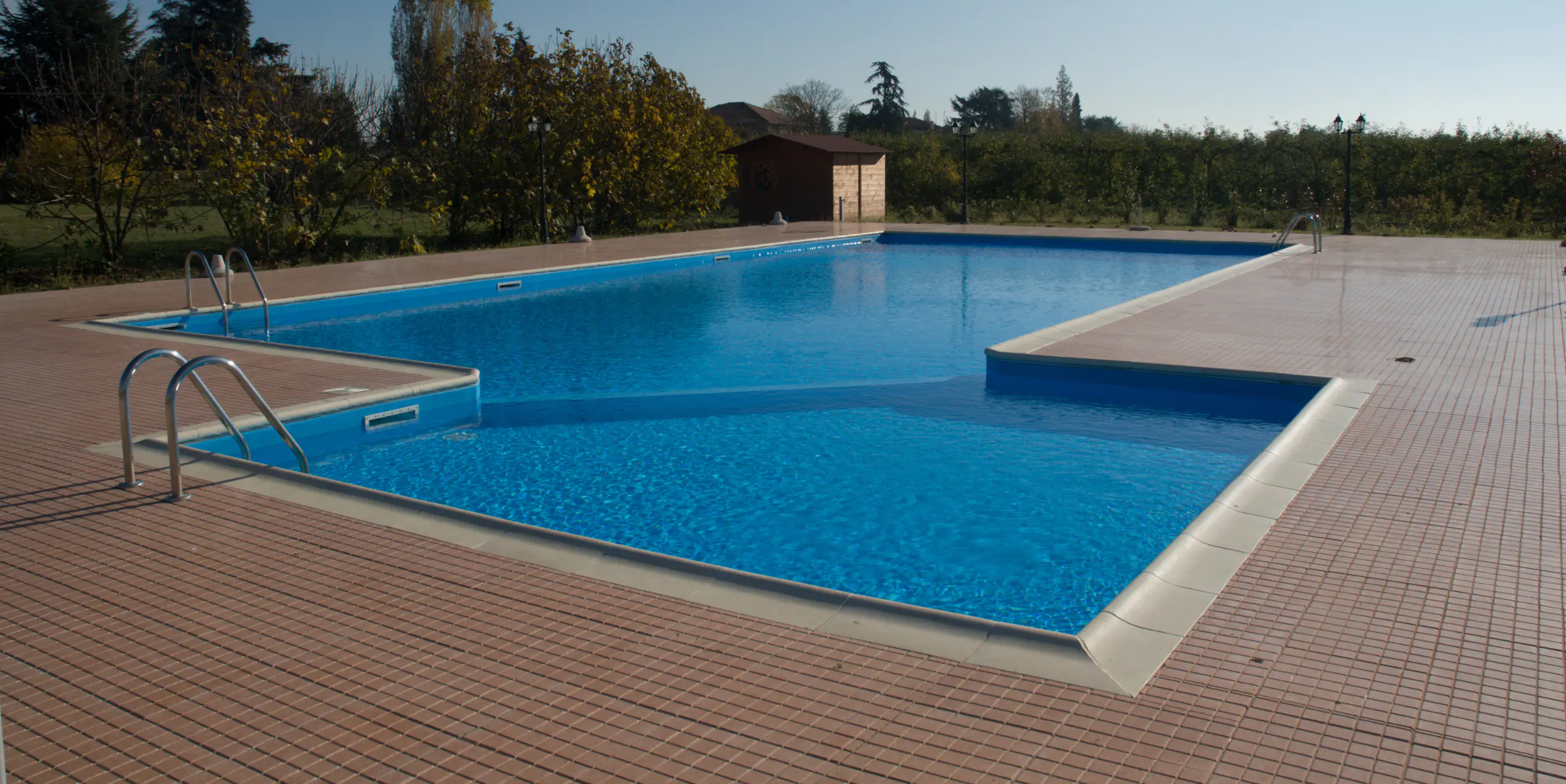 an edgy swimming pool with small square outdoor tiles